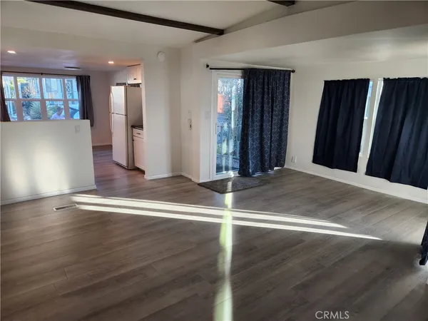 a view of a livingroom with wooden floor