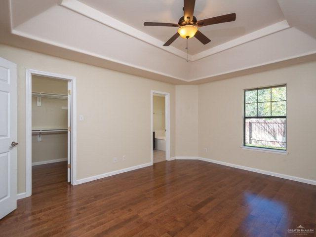 3200 Santa Laura Mission, TX 78572 - Photo 6 of 10 a view of an empty room with window and wooden floor