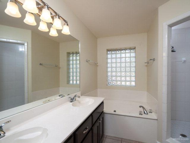 3200 Santa Laura Mission, TX 78572 - Photo 7 of 10 a bathroom with a tub sink and mirror