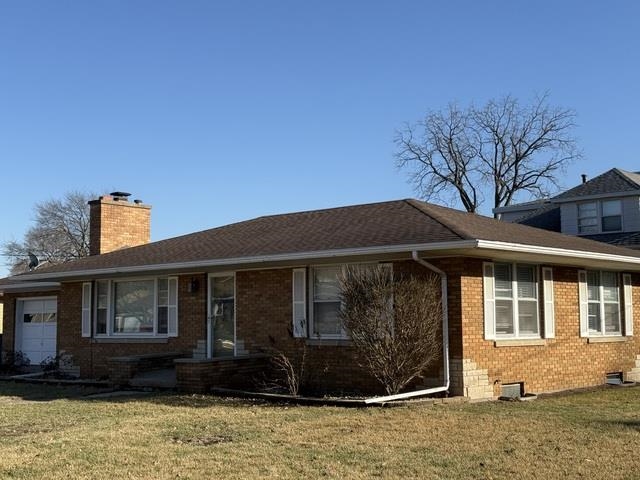 2430 8th Street Peru, IL 61354 - Photo 1 of 25 a front view of a house with a garden