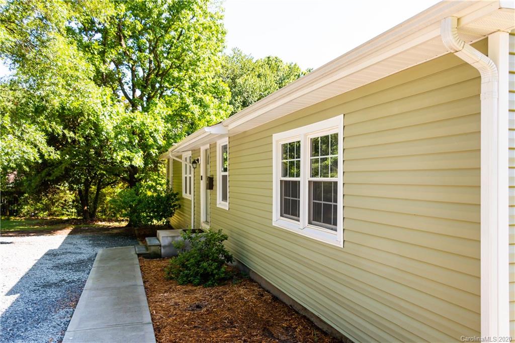 1239 Log Cabin Road Charlotte, NC 28213 - Photo 2 of 26 a view of a house with a backyard