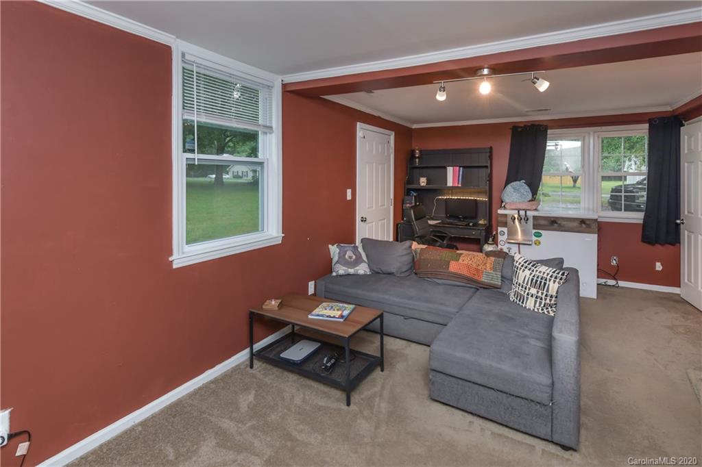 1239 Log Cabin Road Charlotte, NC 28213 - Photo 13 of 26 a living room with furniture and a fireplace