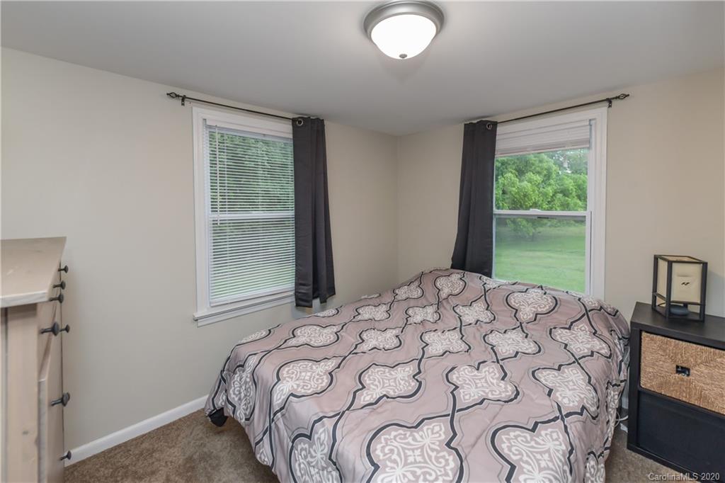 1239 Log Cabin Road Charlotte, NC 28213 - Photo 15 of 26 a bedroom with a bed and a window