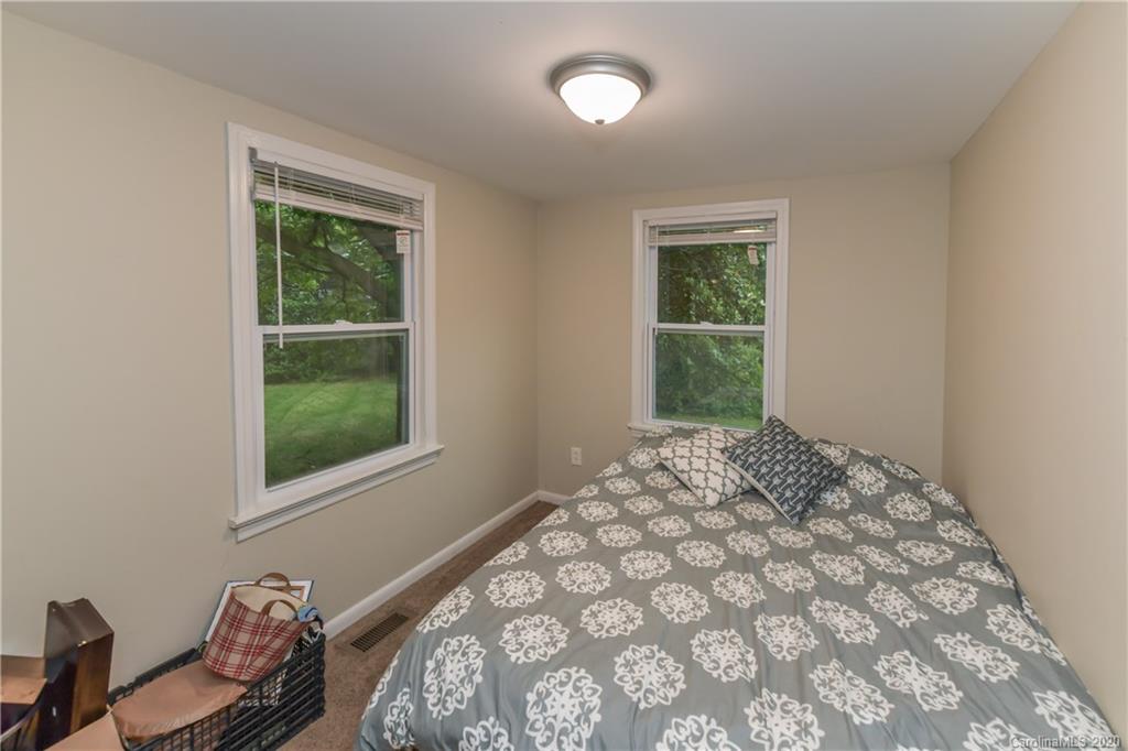 1239 Log Cabin Road Charlotte, NC 28213 - Photo 16 of 26 a bedroom with a bed and a window