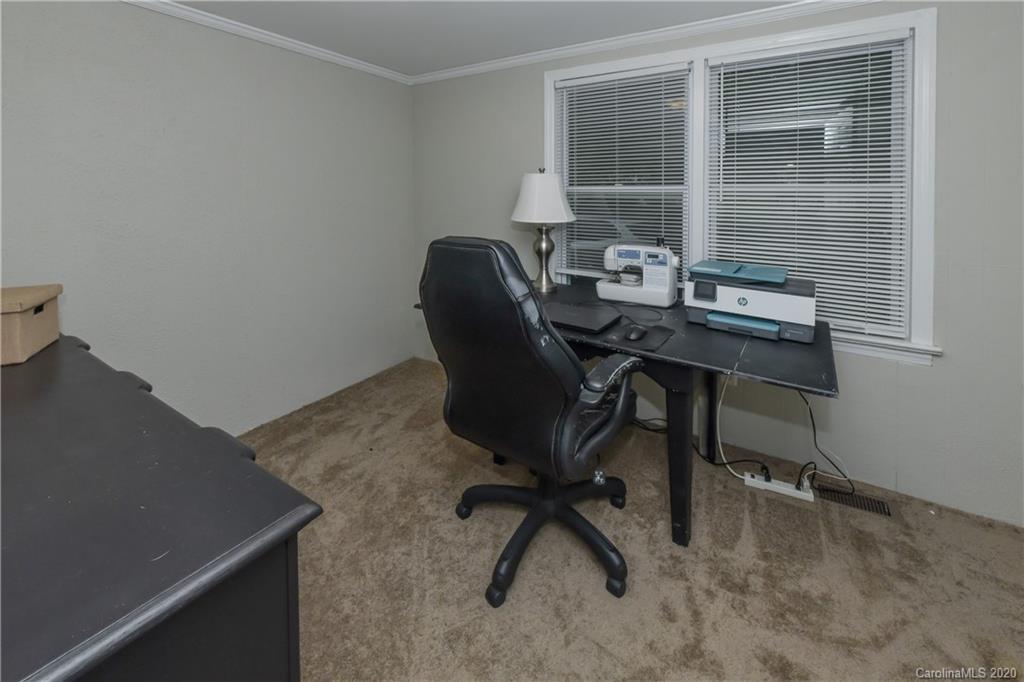 1239 Log Cabin Road Charlotte, NC 28213 - Photo 17 of 26 a view of a workspace with furniture
