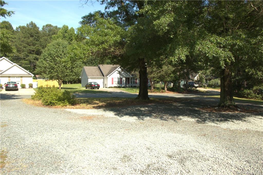 1239 Log Cabin Road Charlotte, NC 28213 - Photo 26 of 26 a view of a yard with a tree