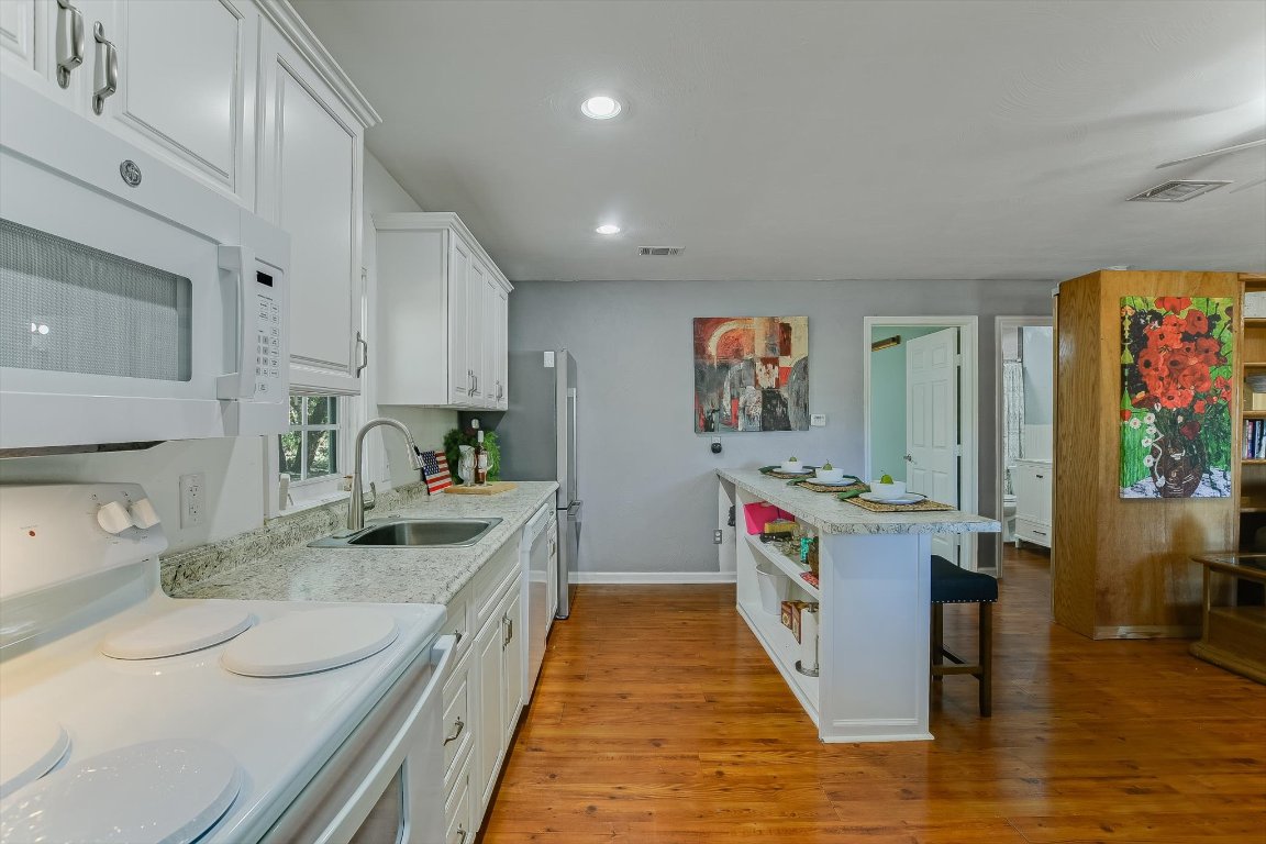 1001 Indian Springs Road Georgetown, TX 78633 - Photo 14 of 30 a large kitchen with stainless steel appliances granite countertop a large stove and a sink