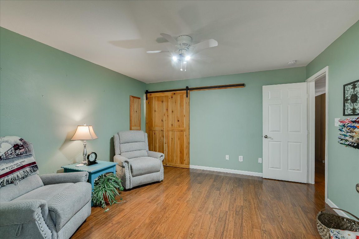 1001 Indian Springs Road Georgetown, TX 78633 - Photo 18 of 30 a living room with furniture and a wooden floor