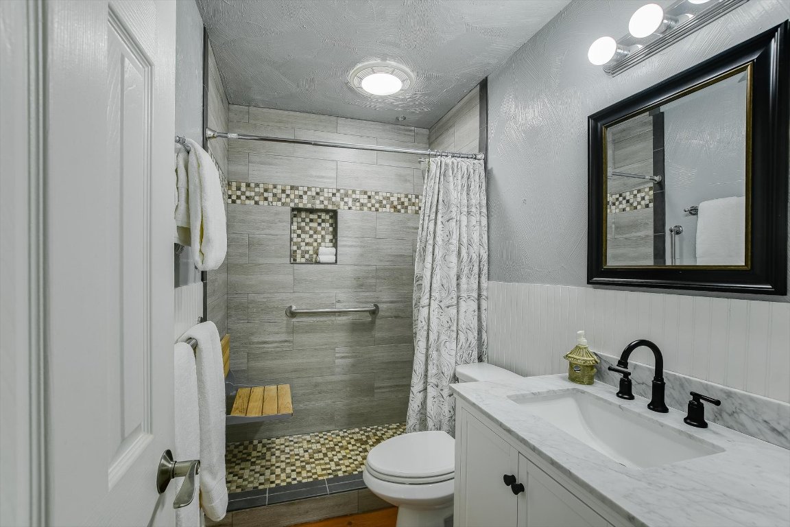 1001 Indian Springs Road Georgetown, TX 78633 - Photo 23 of 30 a bathroom with a sink toilet and shower