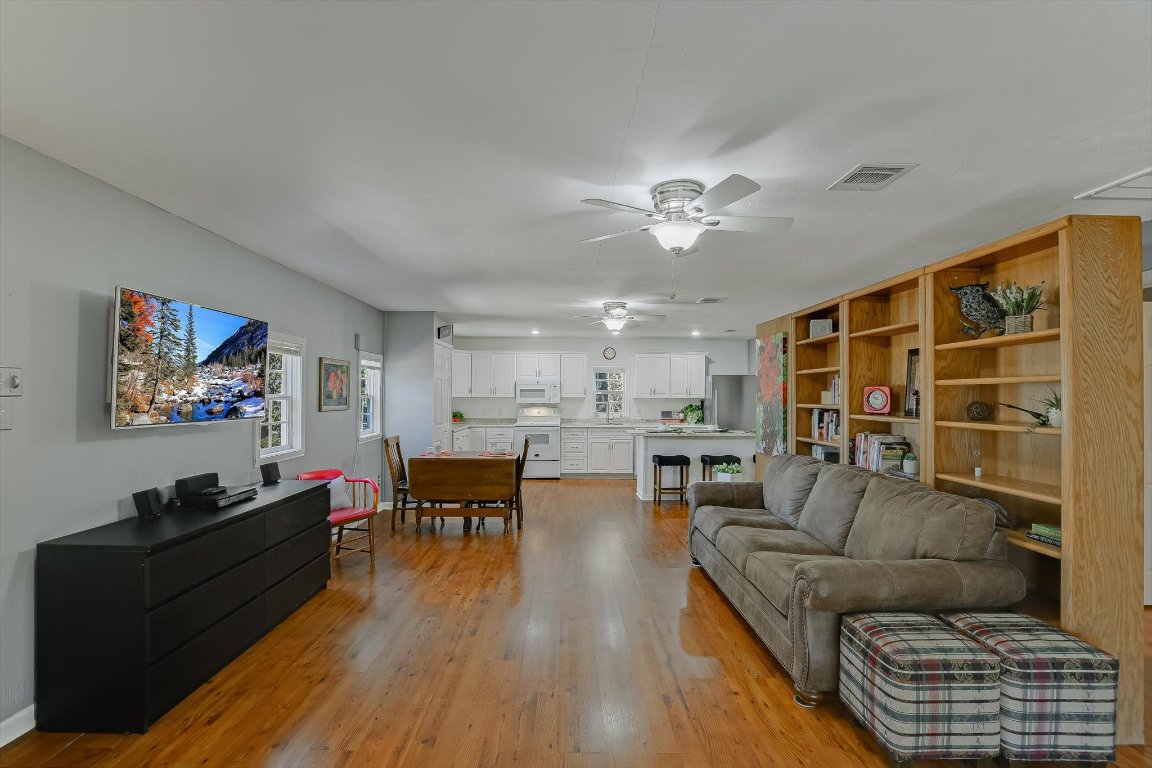 1001 Indian Springs Road Georgetown, TX 78633 - Photo 7 of 30 a living room with furniture kitchen view and a chandelier