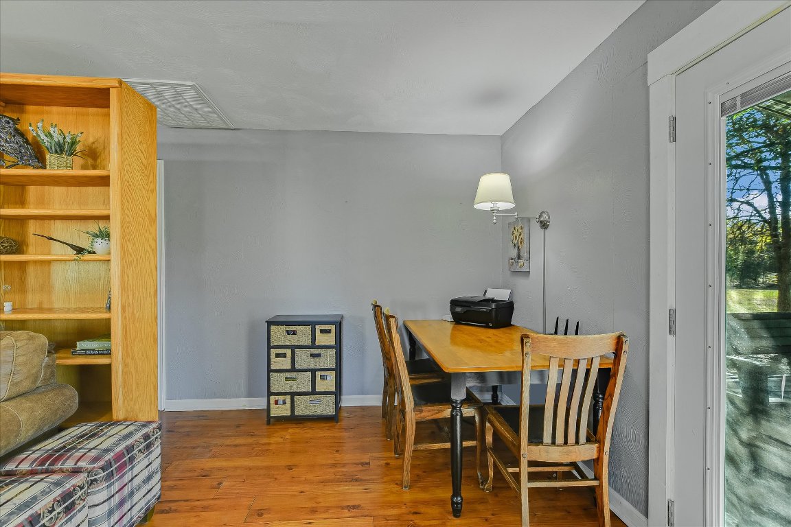 1001 Indian Springs Road Georgetown, TX 78633 - Photo 9 of 30 a view of a dining room with furniture and a window