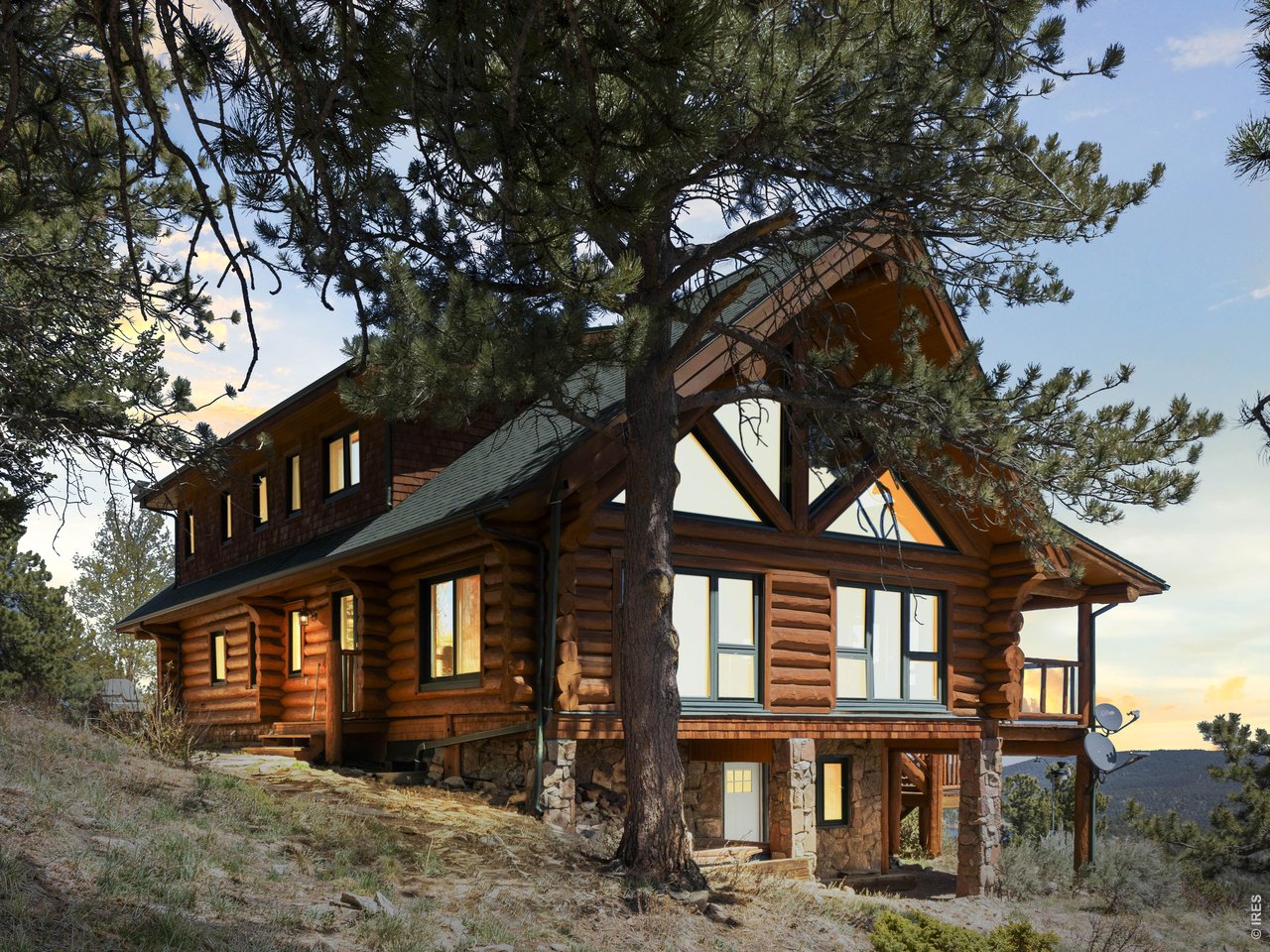 1398 Gold Lake Road Ward, CO 80481 - Photo 1 of 39 a front view of a house with a yard