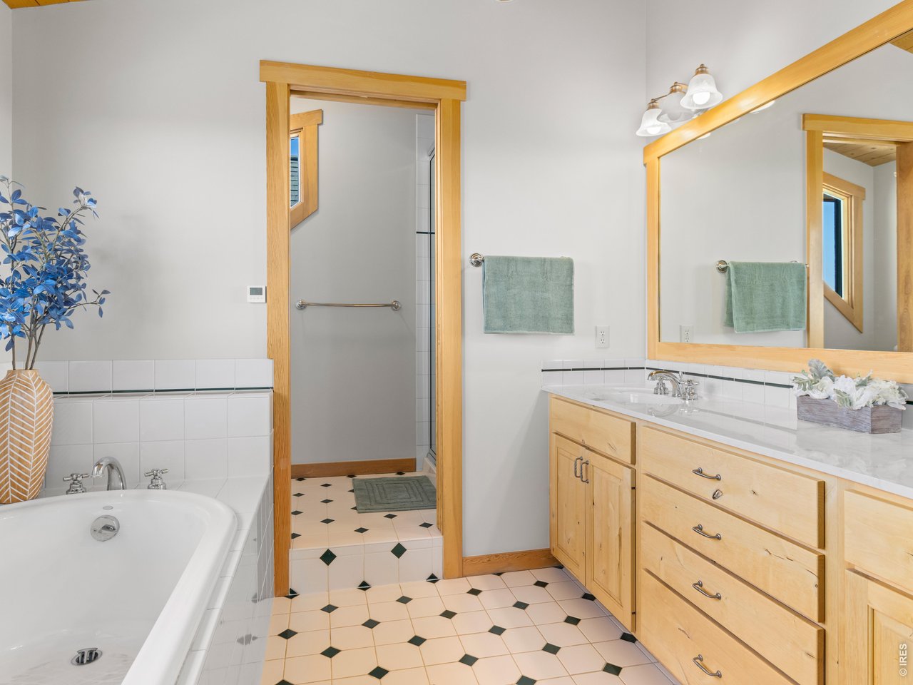 1398 Gold Lake Road Ward, CO 80481 - Photo 20 of 39 a bathroom with a bathtub sink and mirror