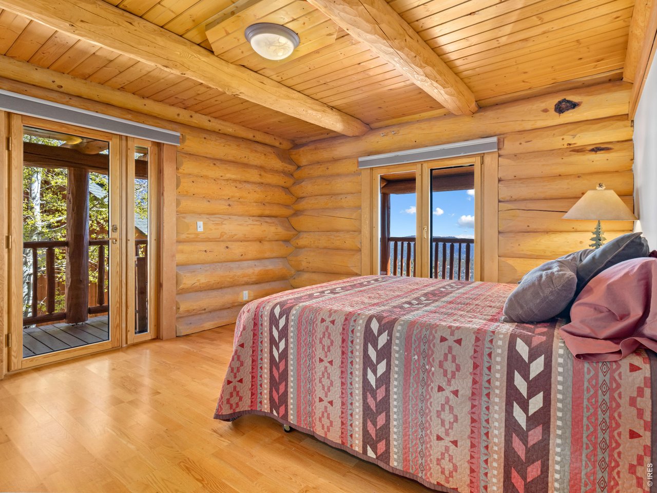 1398 Gold Lake Road Ward, CO 80481 - Photo 24 of 39 a bedroom with a bed and with a tub