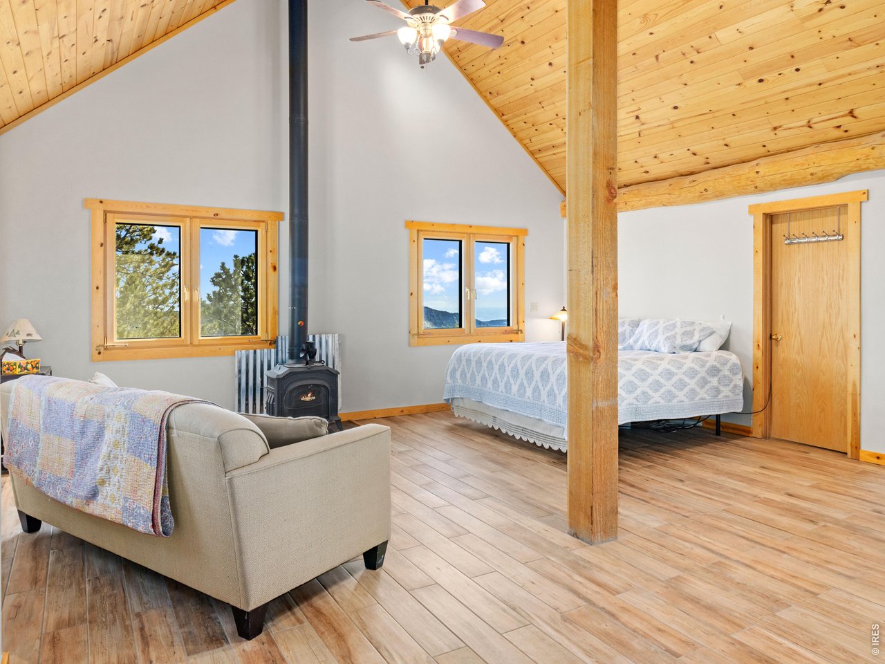1398 Gold Lake Road Ward, CO 80481 - Photo 29 of 39 a bedroom with furniture and a window