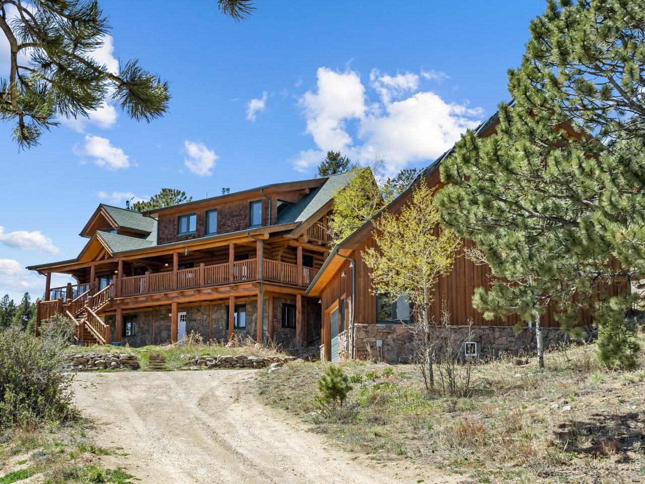1398 Gold Lake Road Ward, CO 80481 - Photo 3 of 39 a front view of a house with a yard