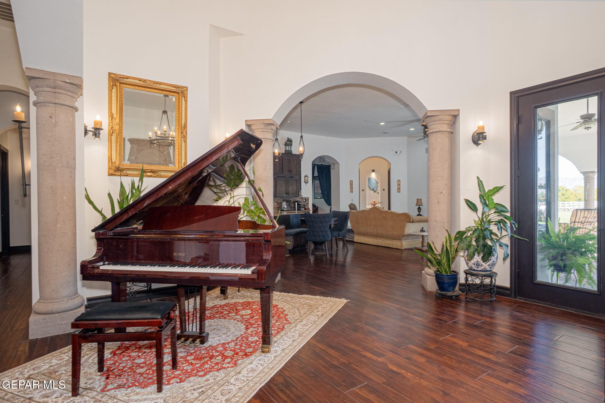 6750 Gato Road El Paso, TX 79932 - Photo 12 of 43 a living room with furniture a window and wooden floor