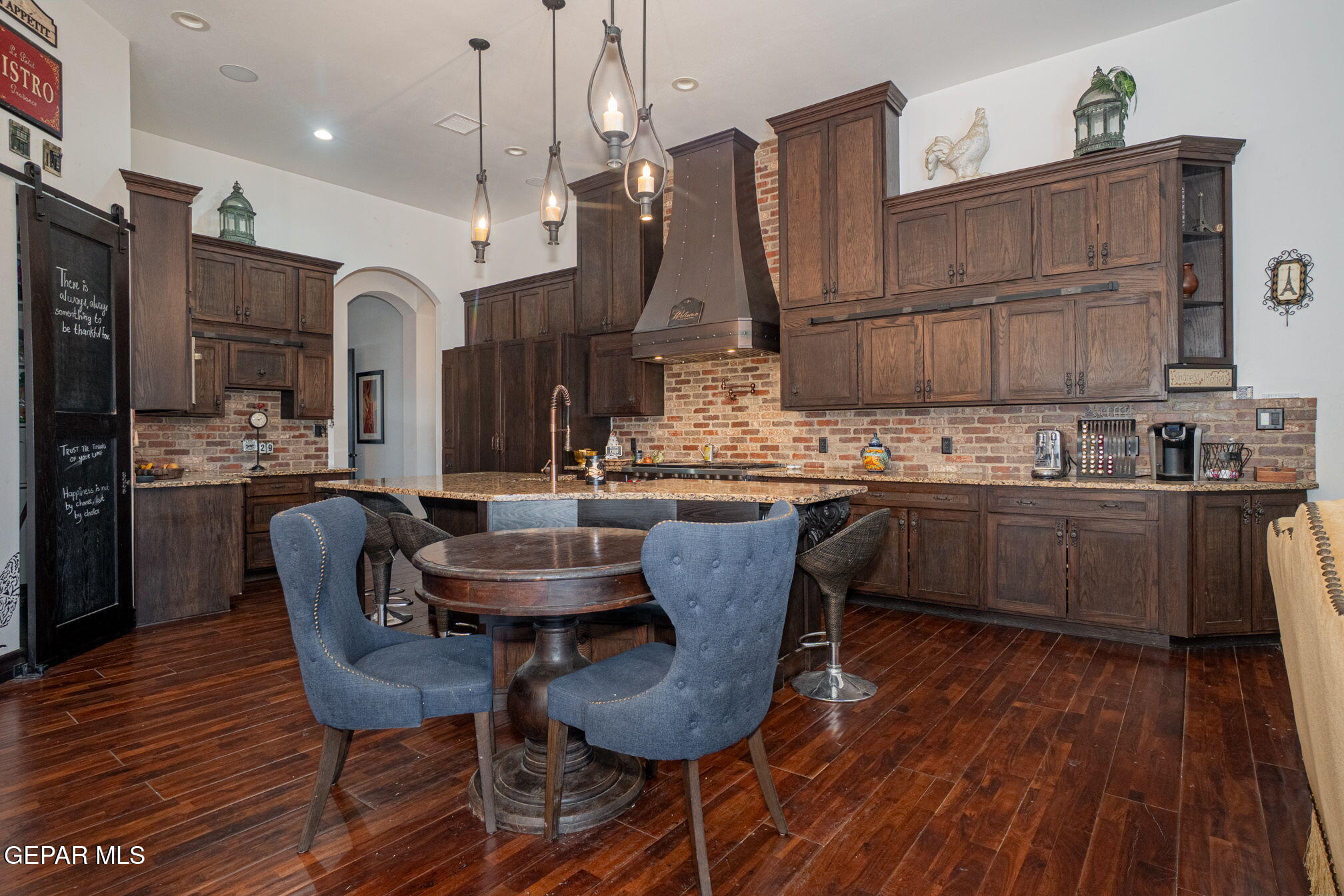6750 Gato Road El Paso, TX 79932 - Photo 14 of 43 a dining room with furniture and wooden floor