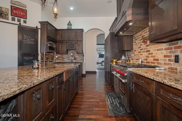 a dining room with furniture and wooden floor