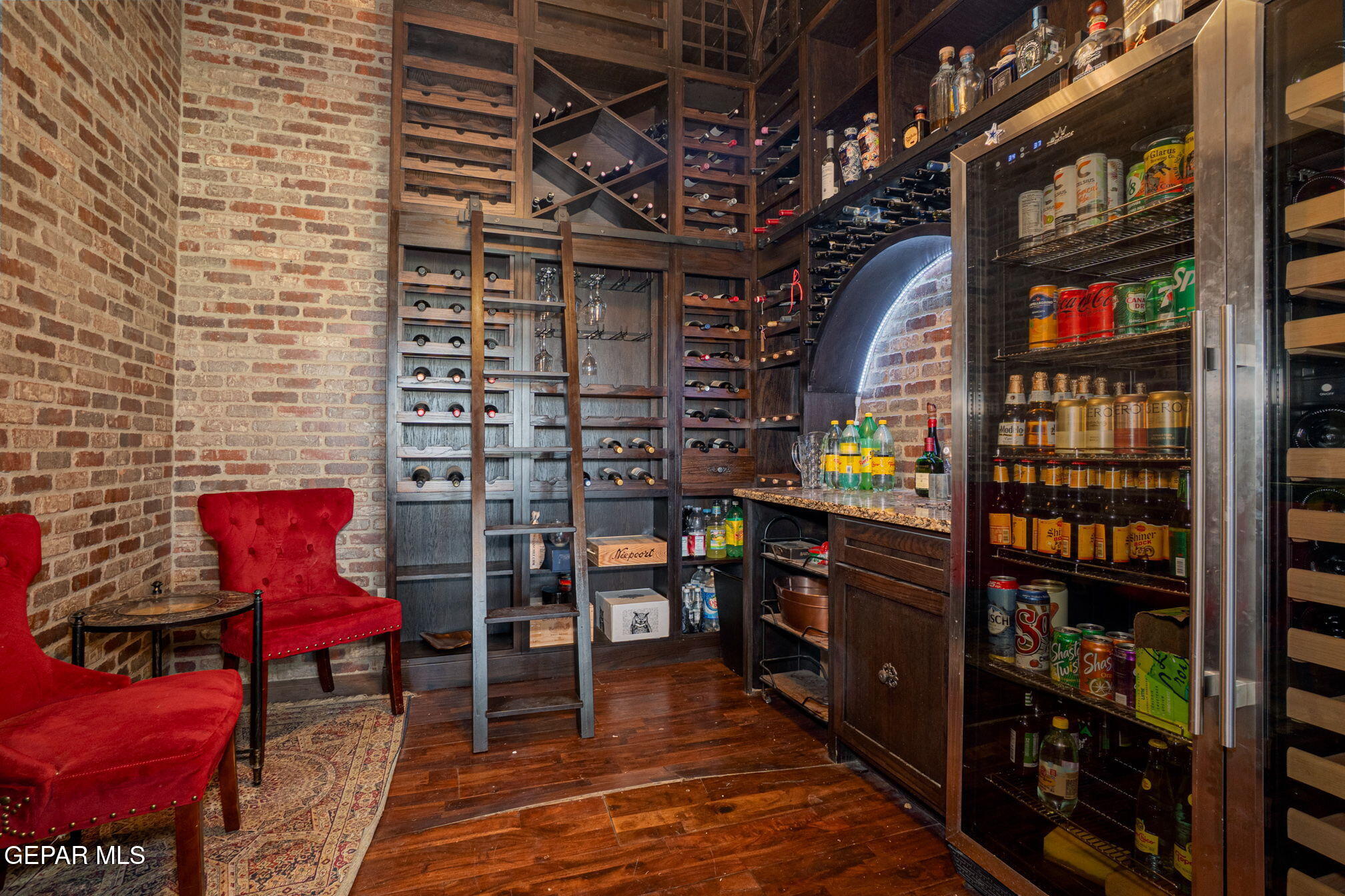 6750 Gato Road El Paso, TX 79932 - Photo 17 of 43 a view of store room with wooden floor