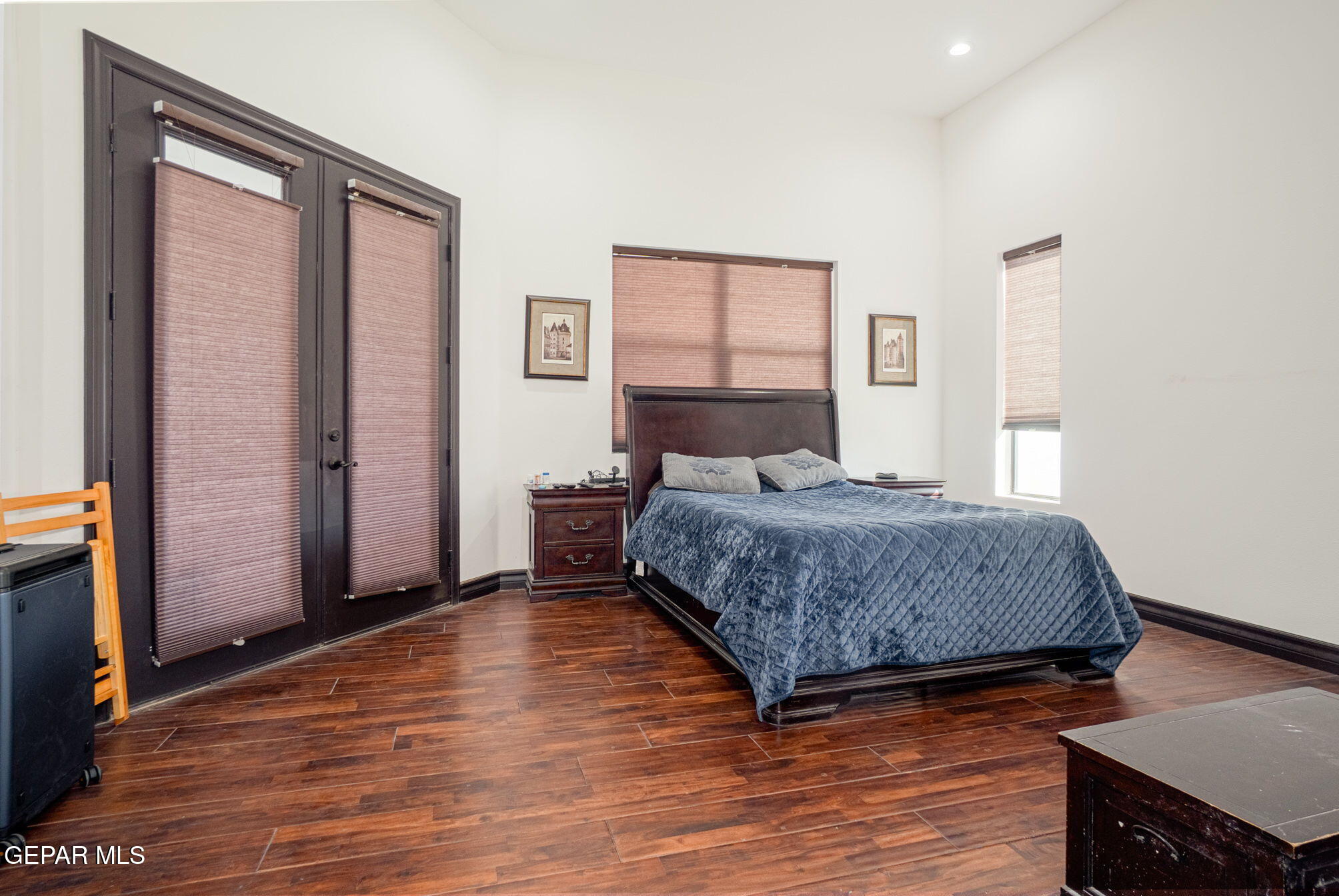 6750 Gato Road El Paso, TX 79932 - Photo 18 of 43 a bedroom with a bed and wooden floor