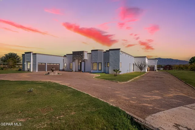 a view of a street with a building in the background
