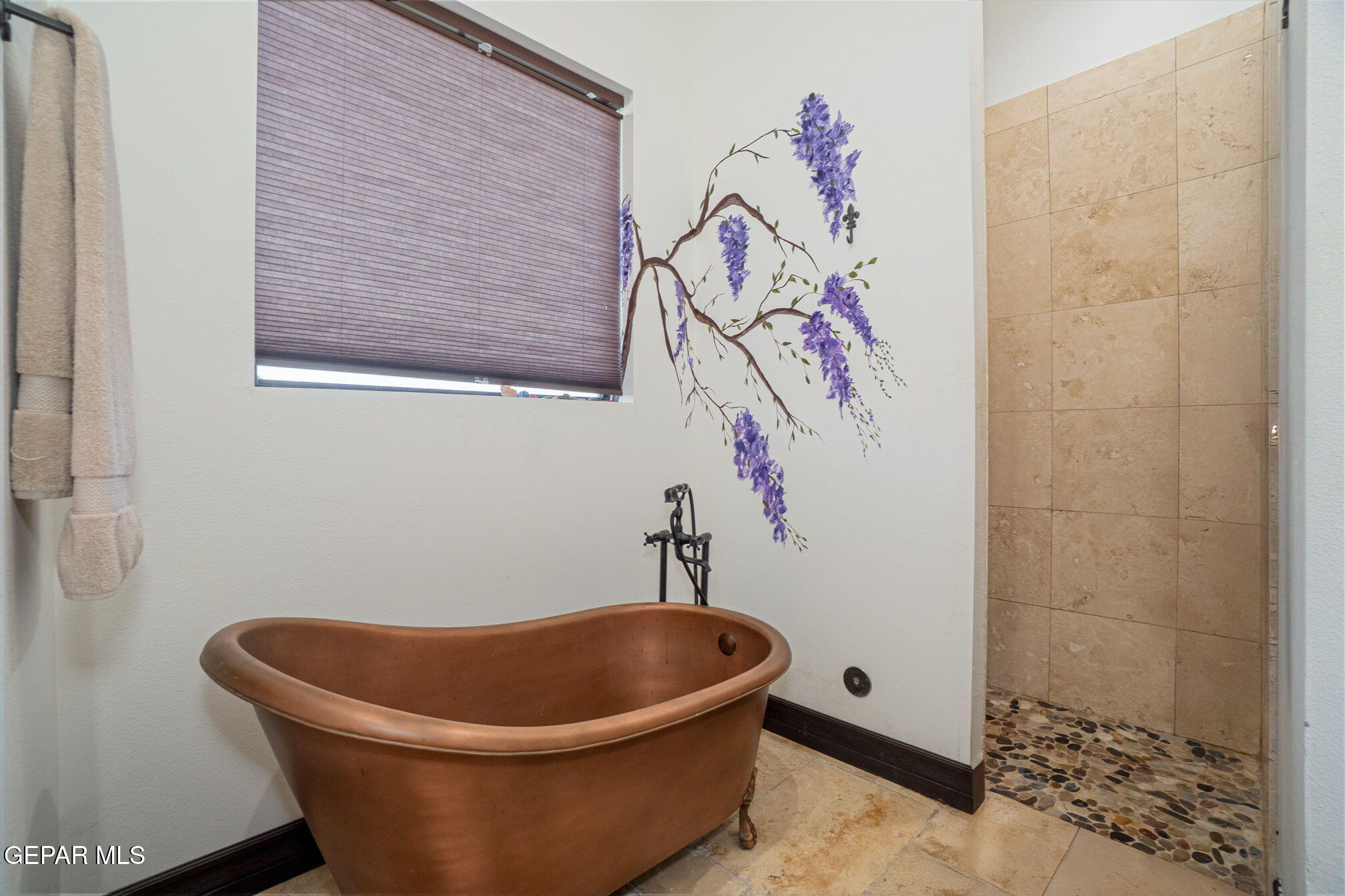 6750 Gato Road El Paso, TX 79932 - Photo 22 of 43 a white bath tub sitting in a bathroom