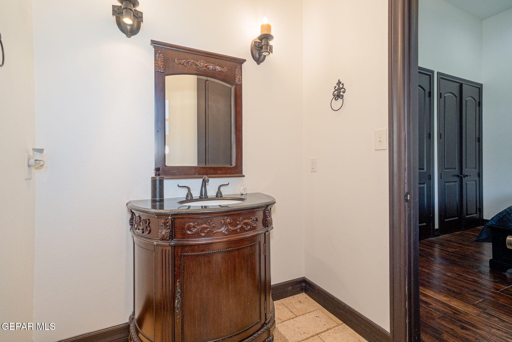 6750 Gato Road El Paso, TX 79932 - Photo 24 of 43 a bathroom with a granite countertop sink a mirror and shower