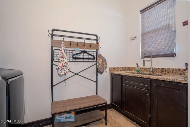 a bathroom with a shower and a sink