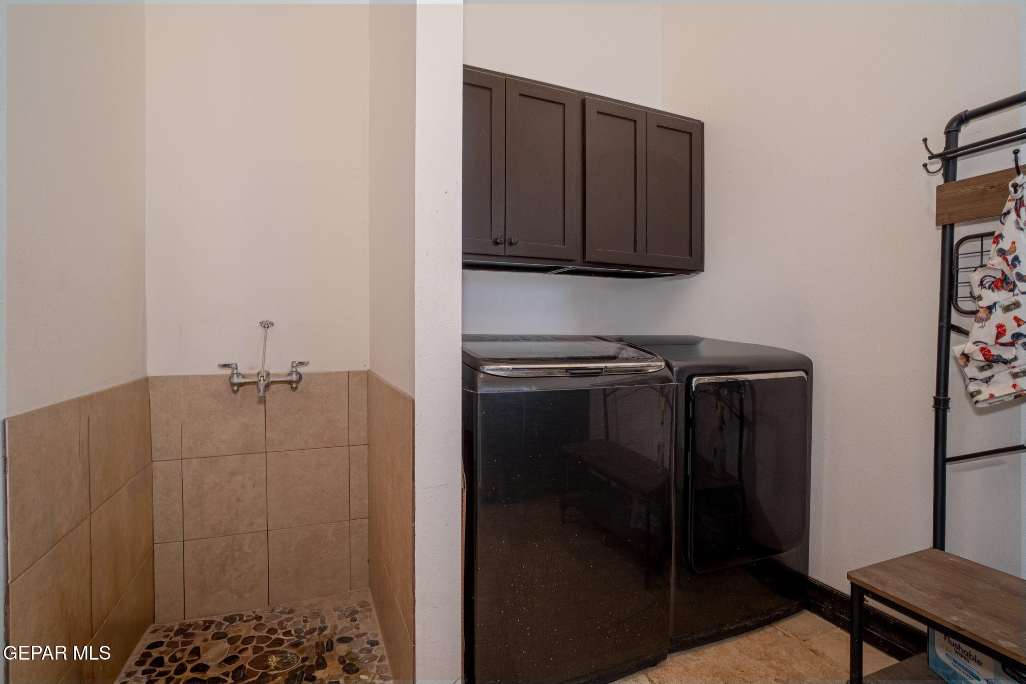 6750 Gato Road El Paso, TX 79932 - Photo 31 of 43 a bathroom with a shower and a sink