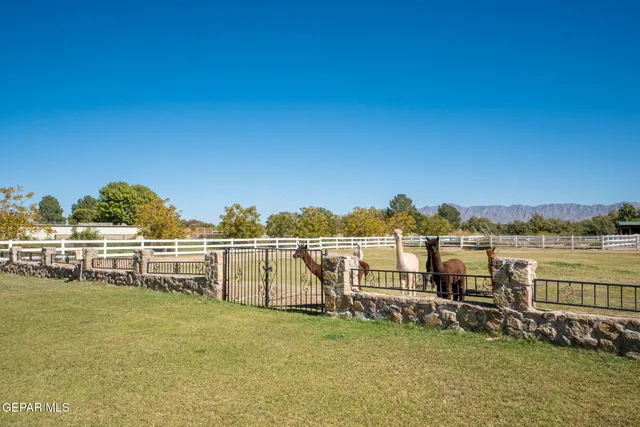 an aerial view of a house with an outdoor space