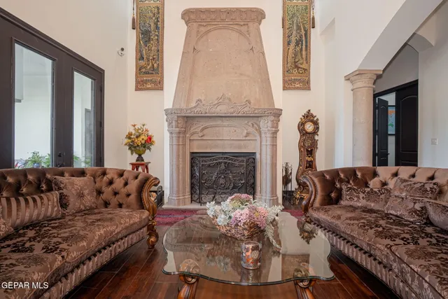 a living room with furniture and a fireplace
