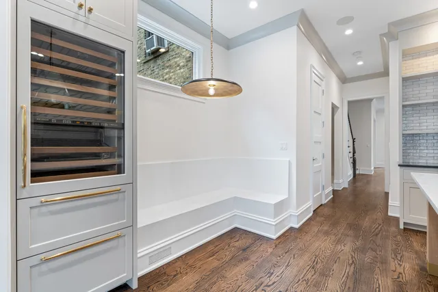 a view of kitchen with wooden floor and window