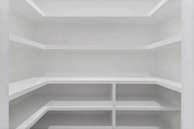 a view of a kitchen with a sink and a fireplace