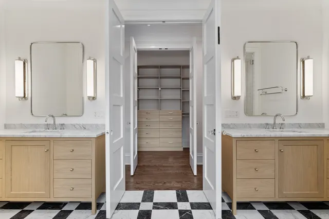 a bathroom with a granite countertop sink a toilet and a mirror