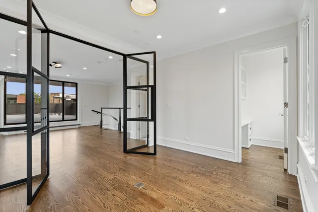 a view of an empty room with windows