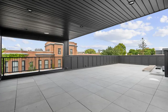 an aerial view of a house with outdoor space