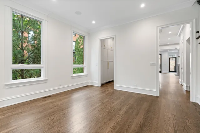 a kitchen with a stove a sink a refrigerator and window