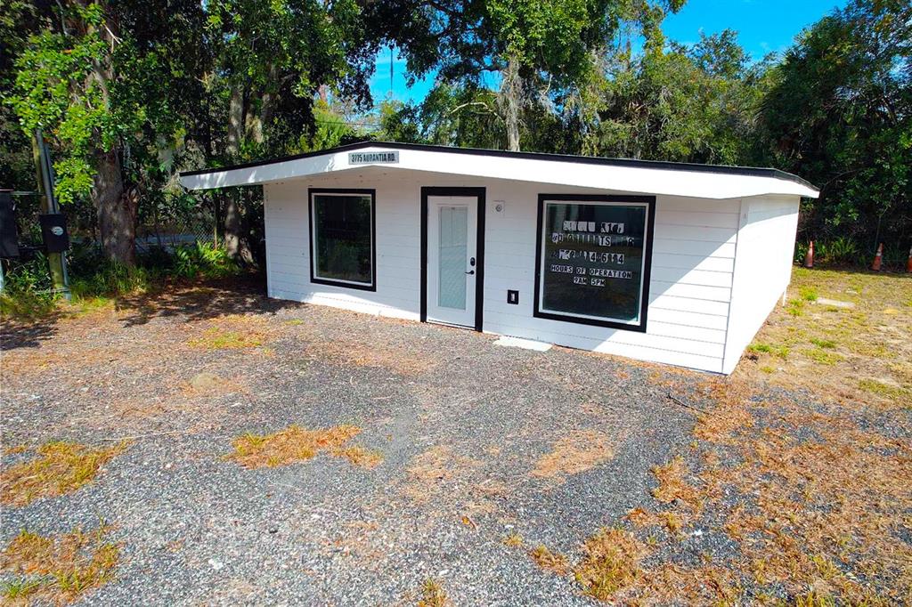 4795 Highway 1 Mims, FL 32754 - Photo 11 of 22 a view of a house with a yard and garage