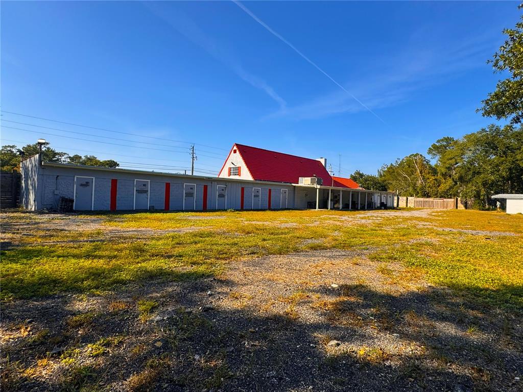 4795 Highway 1 Mims, FL 32754 - Photo 14 of 22 a swimming pool with outdoor seating and yard