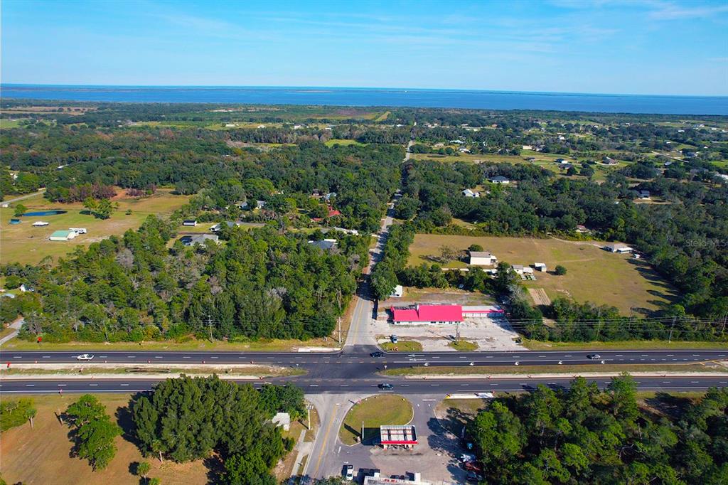 4795 Highway 1 Mims, FL 32754 - Photo 18 of 22 an aerial view of residential houses with outdoor space and swimming pool