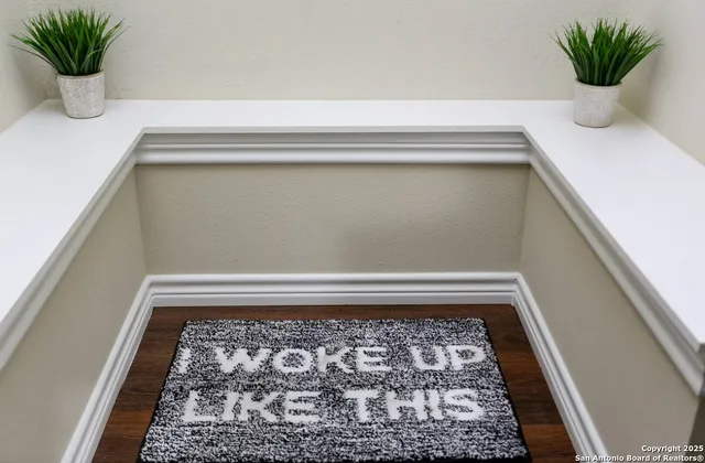 a bathroom with a plant