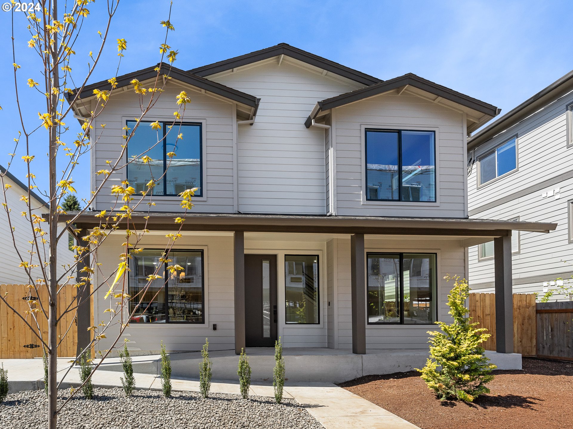 front view of a house with a small yard