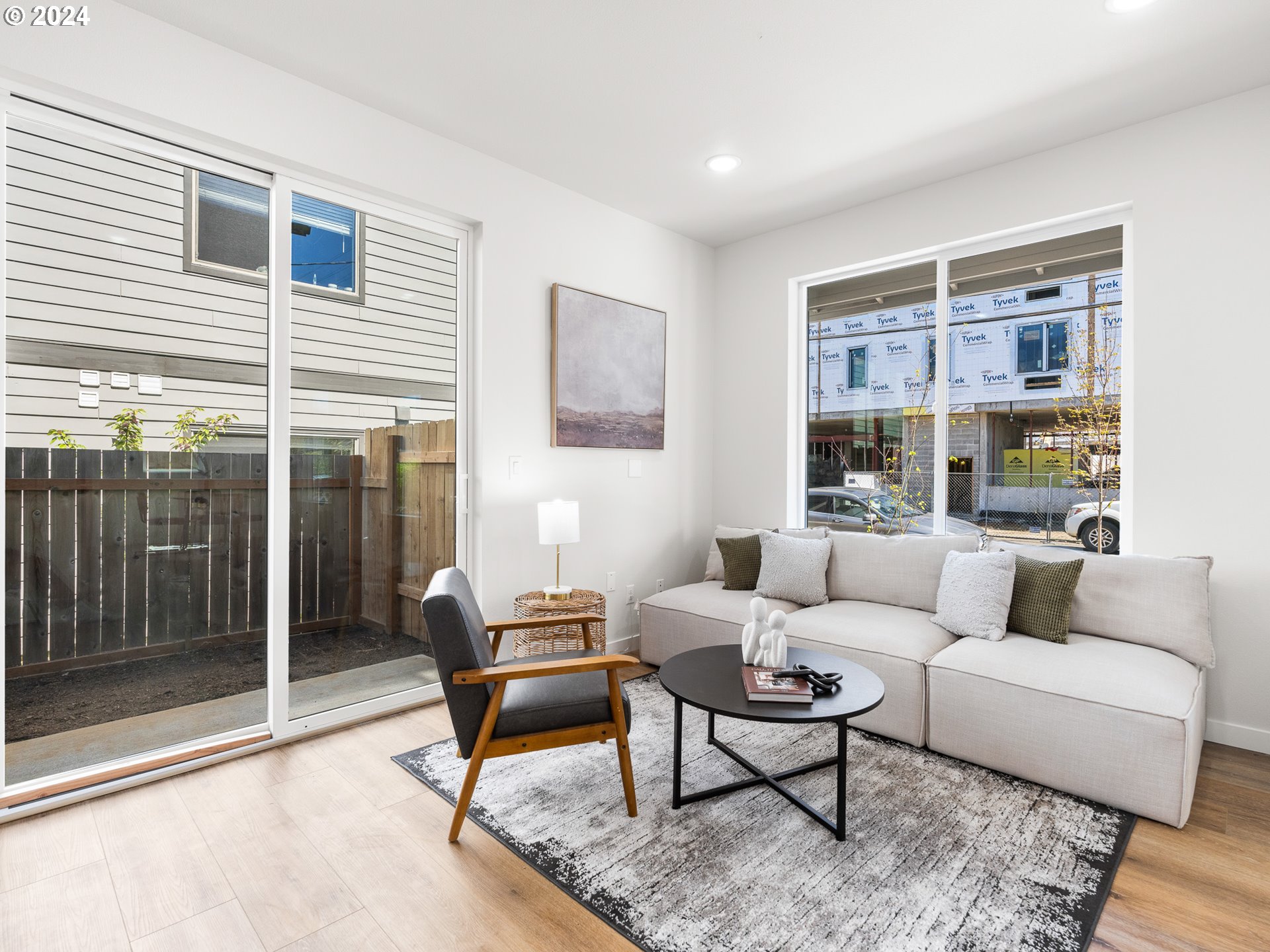 457 Northeast 74th Avenue, Unit 1 Portland, OR 97213 - Photo 14 of 26 a living room with furniture a rug and a large window