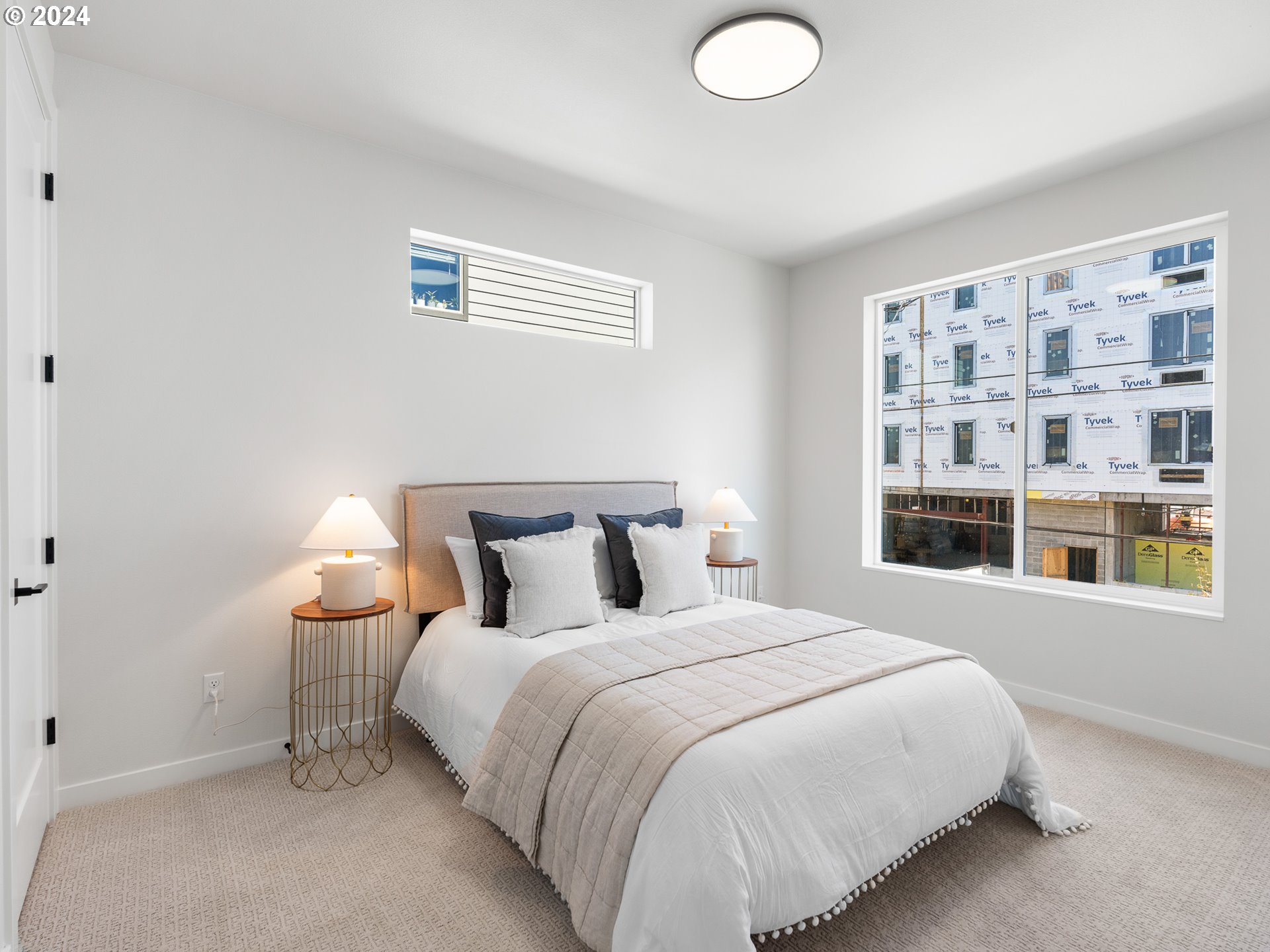457 Northeast 74th Avenue, Unit 1 Portland, OR 97213 - Photo 16 of 26 a bedroom with a bed and a window