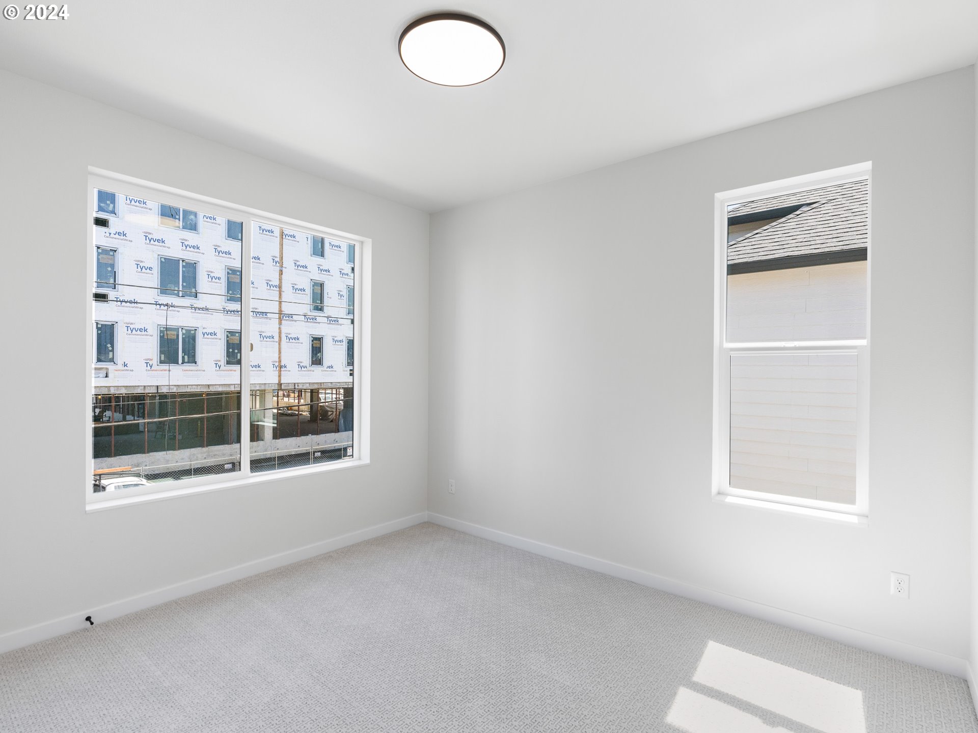 457 Northeast 74th Avenue, Unit 1 Portland, OR 97213 - Photo 18 of 26 a view of an empty room with a window