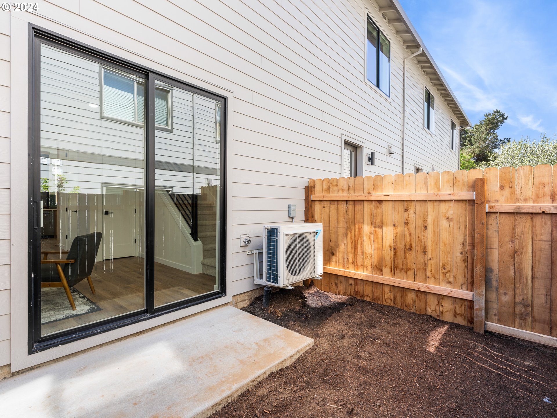 457 Northeast 74th Avenue, Unit 1 Portland, OR 97213 - Photo 20 of 26 a view of a house with backyard and wooden fence