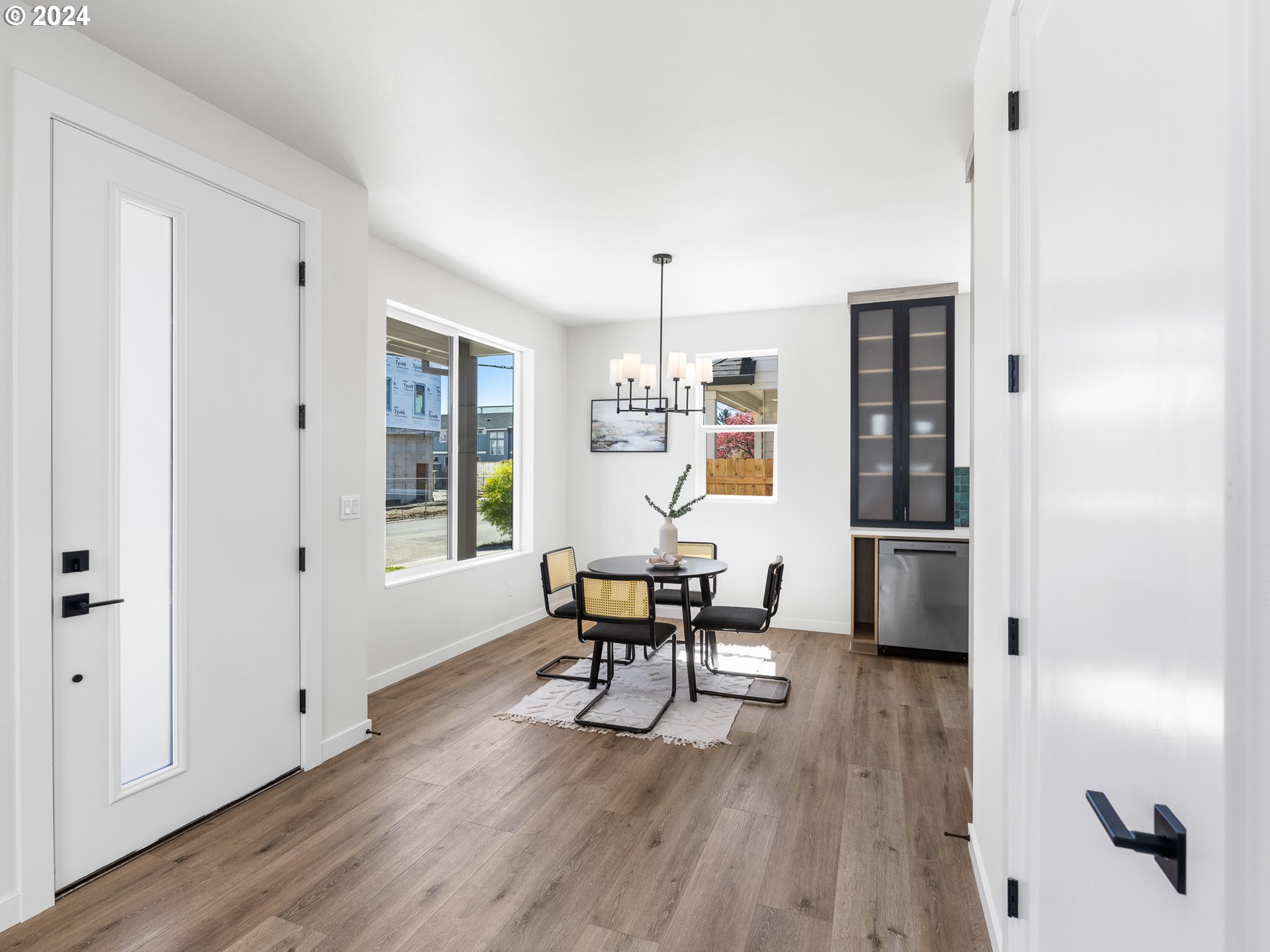 457 Northeast 74th Avenue, Unit 1 Portland, OR 97213 - Photo 4 of 26 a view of a dining room with furniture and wooden floor