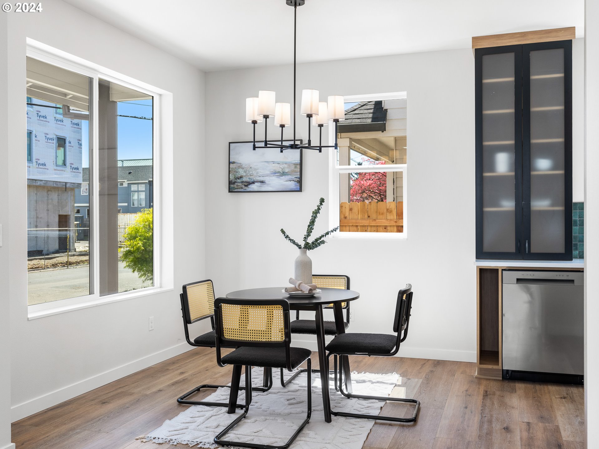 457 Northeast 74th Avenue, Unit 1 Portland, OR 97213 - Photo 5 of 26 a view of a dining room with furniture window and wooden floor