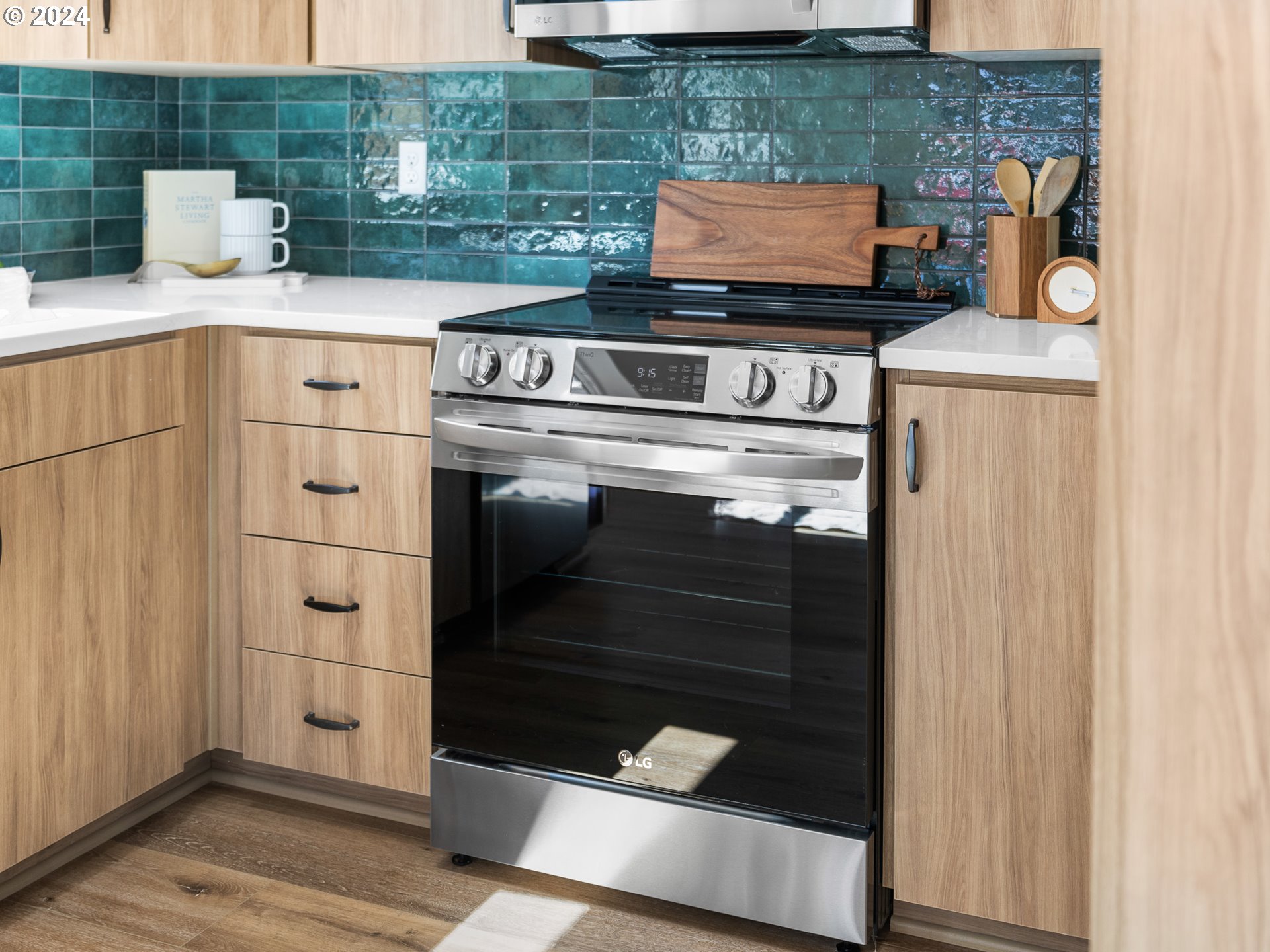 457 Northeast 74th Avenue, Unit 1 Portland, OR 97213 - Photo 9 of 26 a stove top oven sitting inside of a kitchen